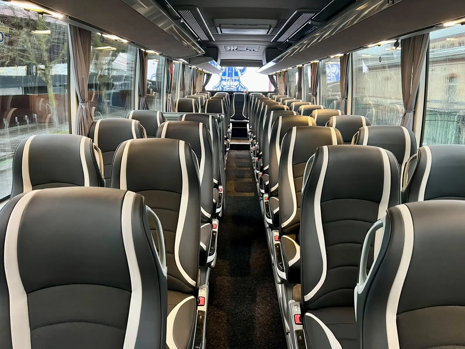 Coach interior with black and grey leather seats