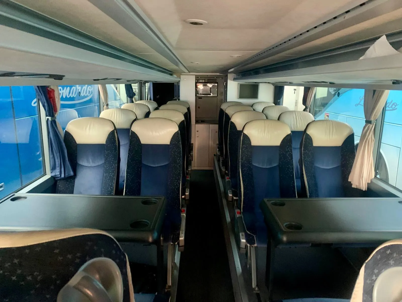 Upper deck of the double-decker coach, with seats and tables